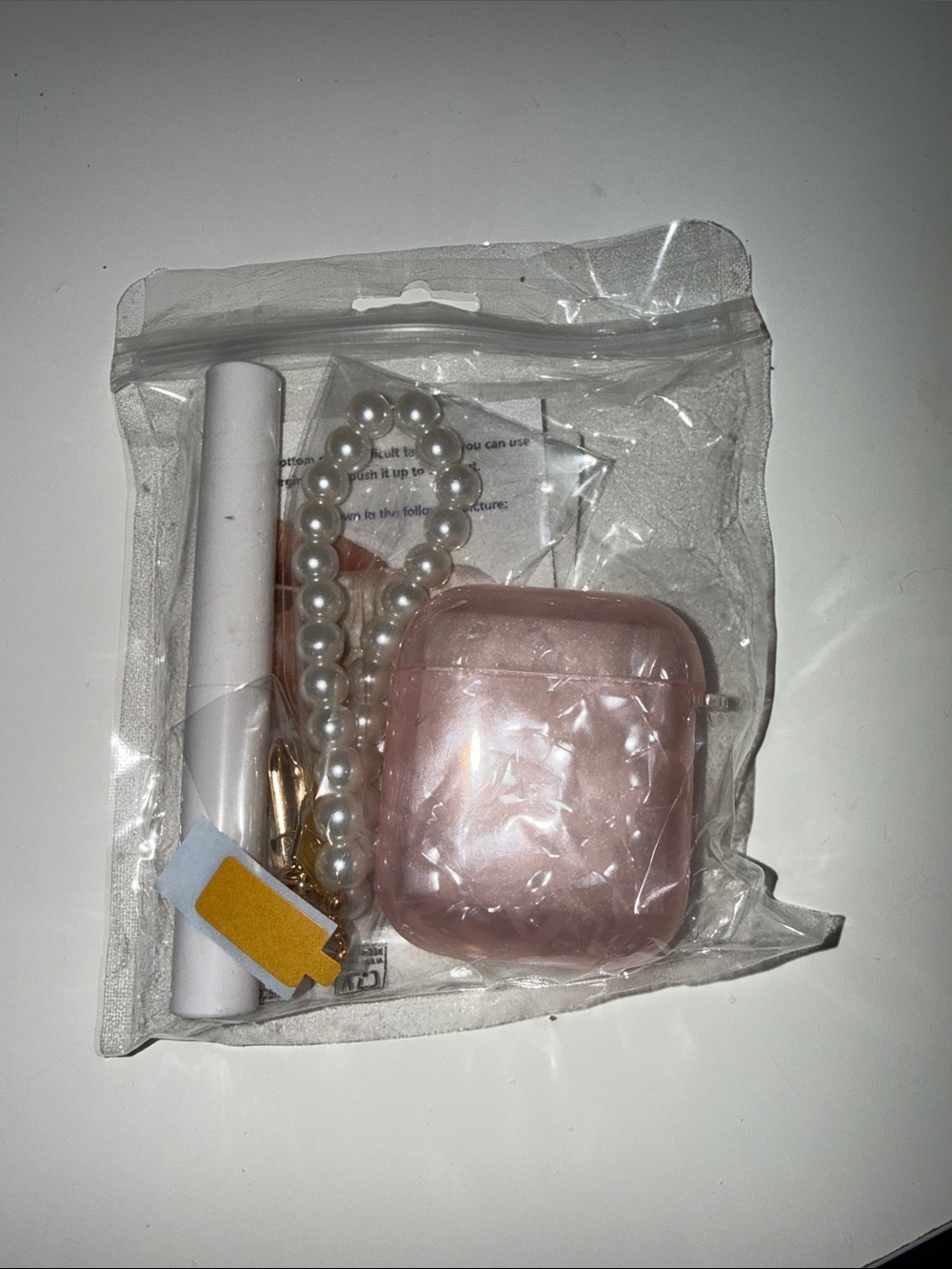 Pink marbled AirPod Case with pearl keychain